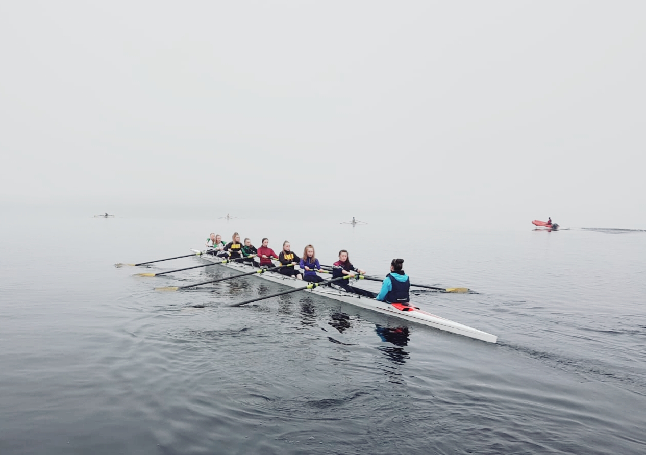 Junior eight training in misty conditions on the lake
